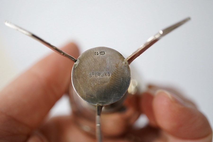 A Georgian silver mounted cut glass caster, London, 1818, 15.7cm, together with a Japanese silver condiment on tripod supports, import marks for Harrods Ltd, London, 1920. Condition - poor to fair